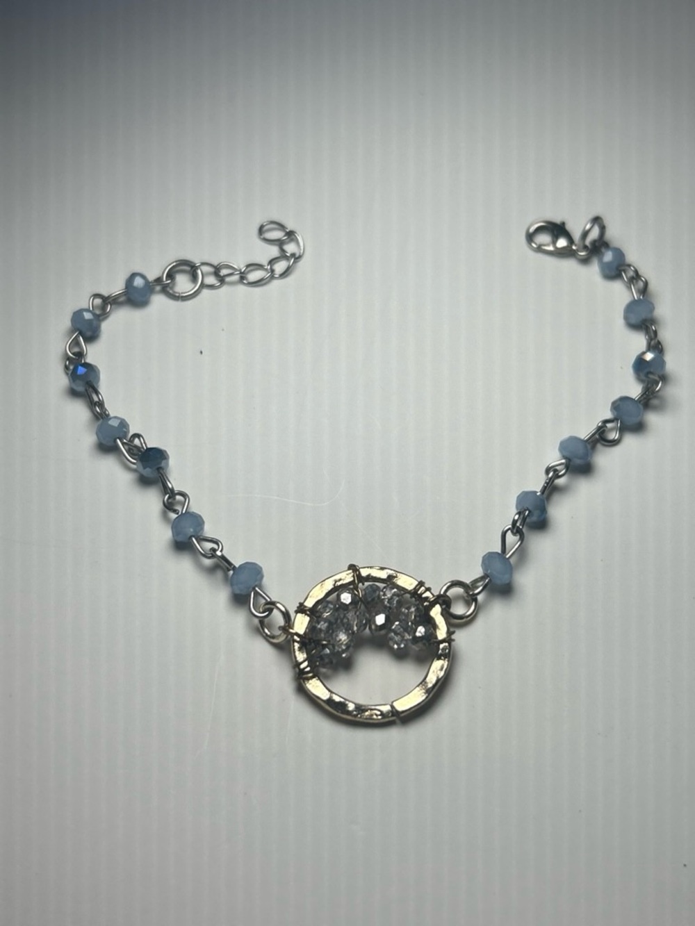 Delicate Handcrafted Silver Circle Bracelet with Light Blue Beads